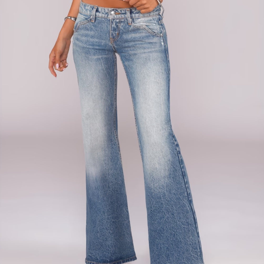 Flared Denim Jeans With A Retro Y2K Vibe Featuring A Washed And Distressed Finish For A Cool Edgy Look