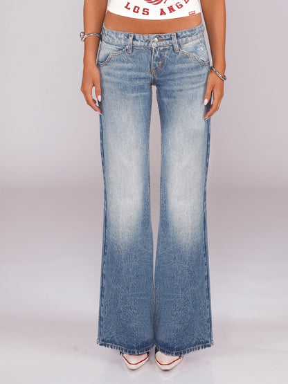 Flared Denim Jeans With A Retro Y2K Vibe Featuring A Washed And Distressed Finish For A Cool Edgy Look